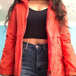 Free People bright neon orange rain jacket